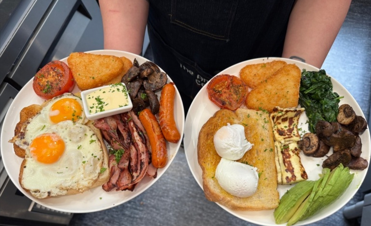 Two big breakfast plates ready at the pass